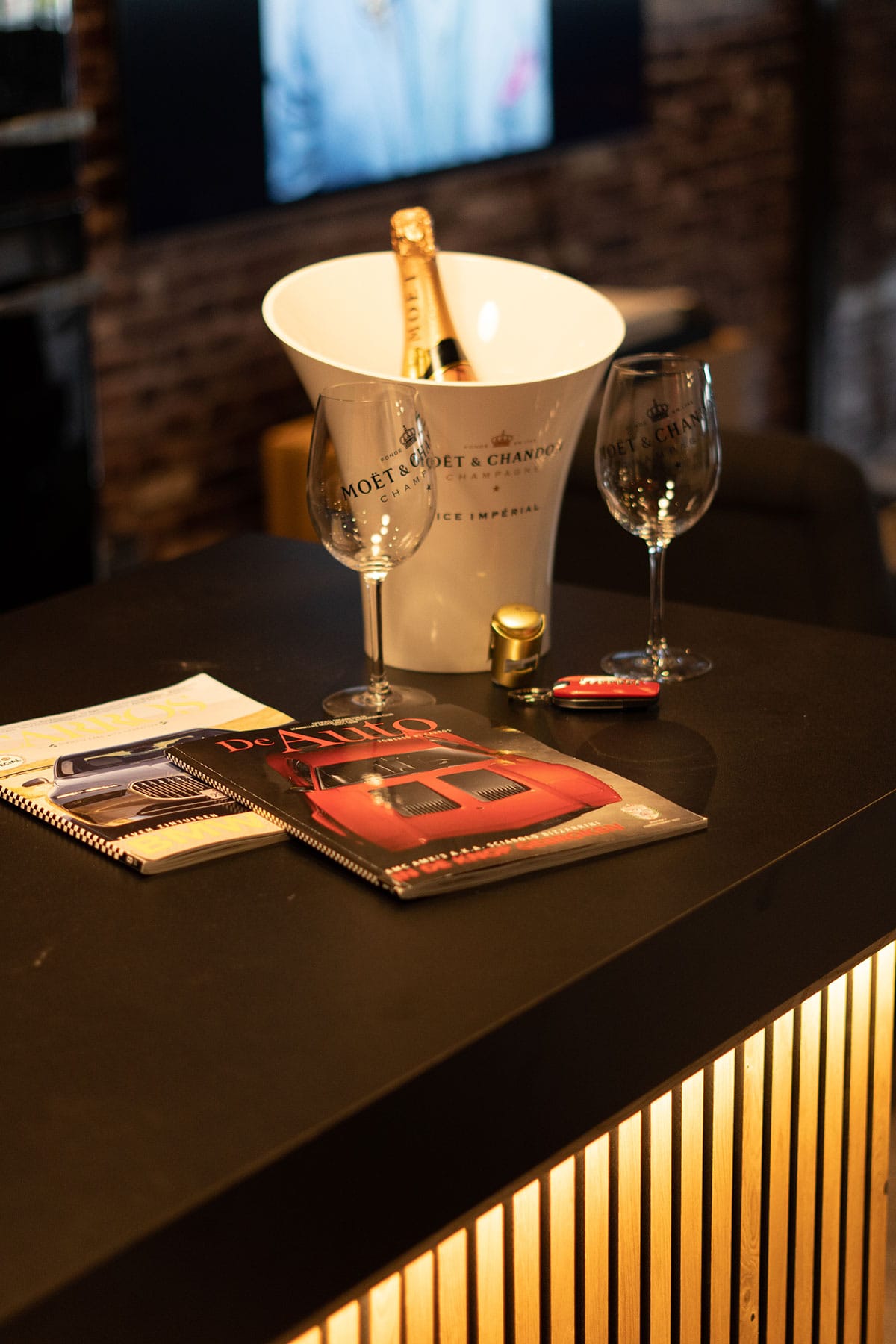 GT Exclusive lounge with champagne and car magazines